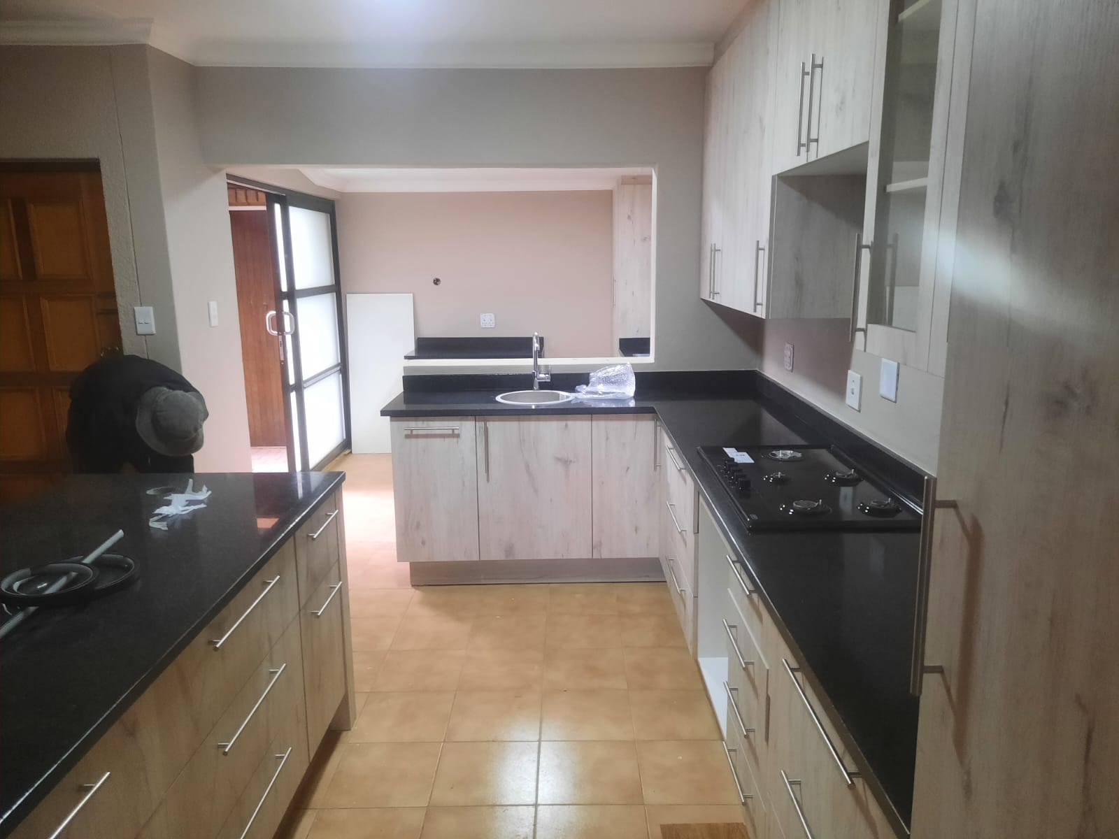 New kitchen renovation with granite tops, tiling and cabinets in Hartbeespoort